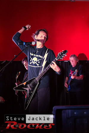 Guitarist Keith Stacy flying the V guitar.