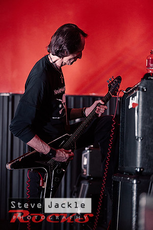Guitarist Keith Stacy flying the V guitar.