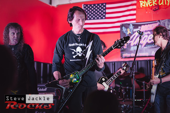 Guitarist Keith Stacy flying the V guitar.