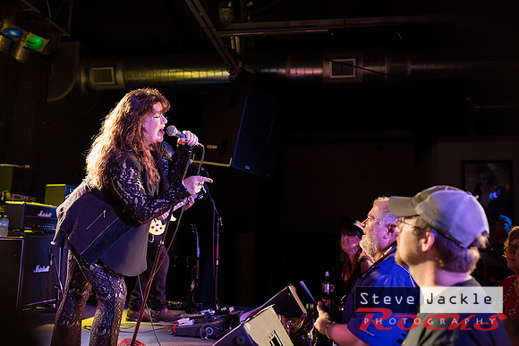 Stacey Winn:  vocals pointing out  a photographer in the crowd.